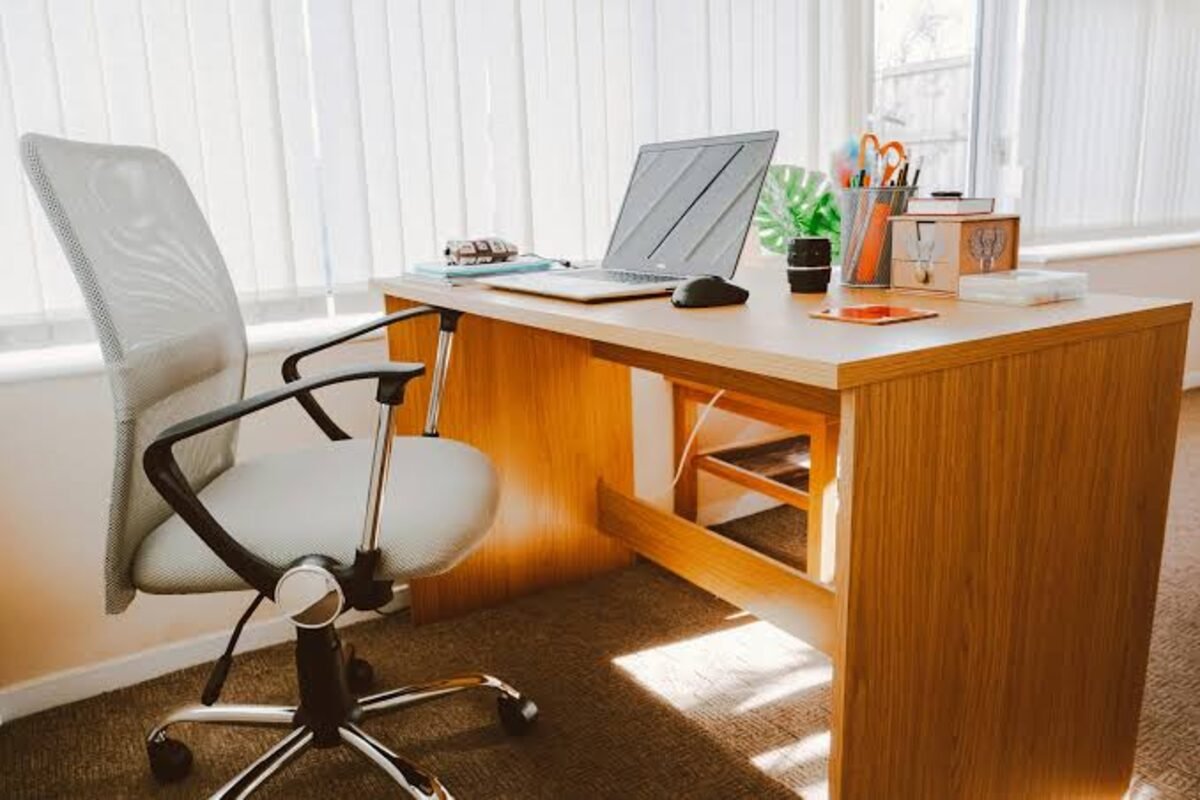 Black Wood filing cabinet beside a desk